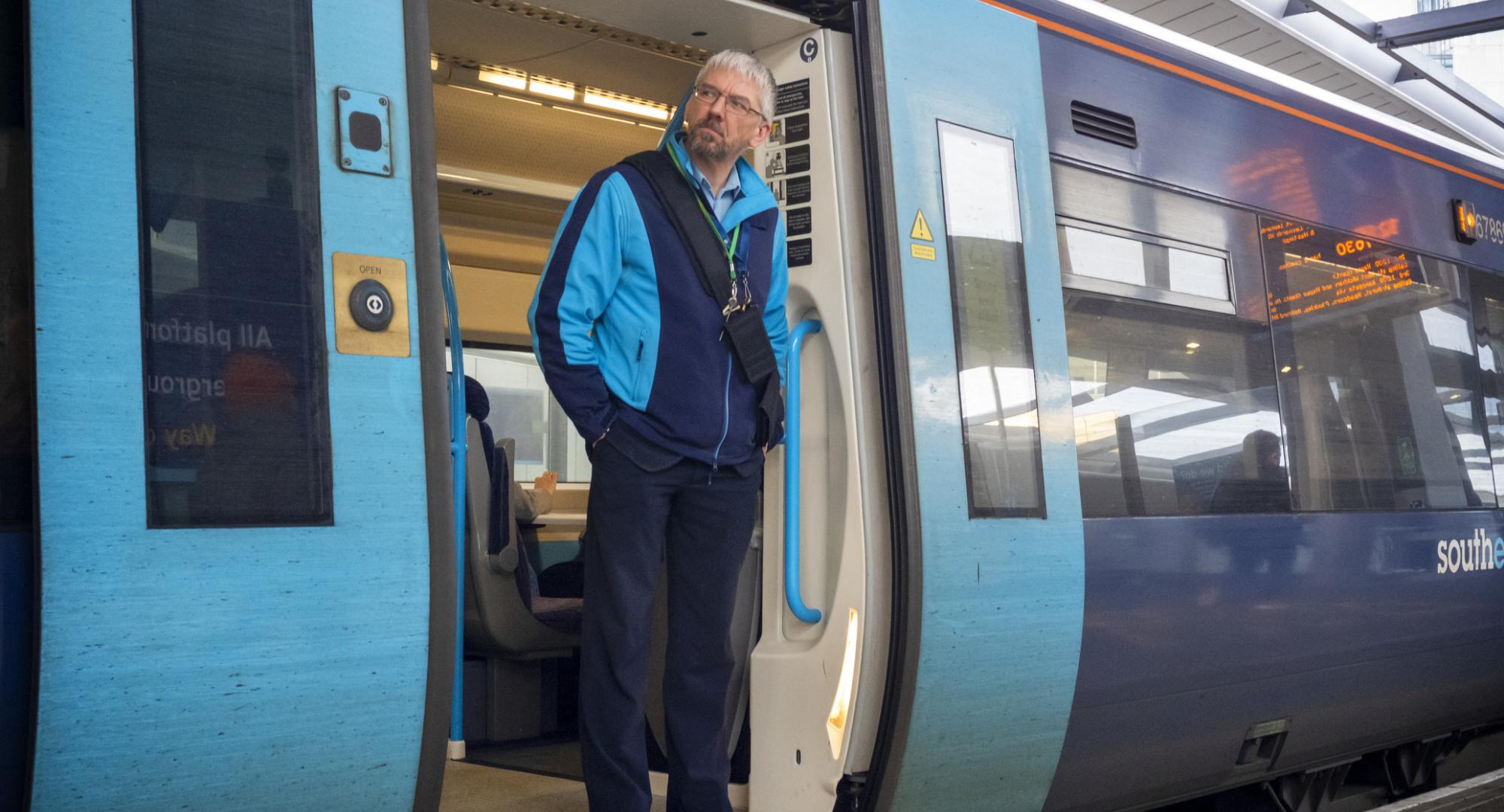 Train guard standing in the train door