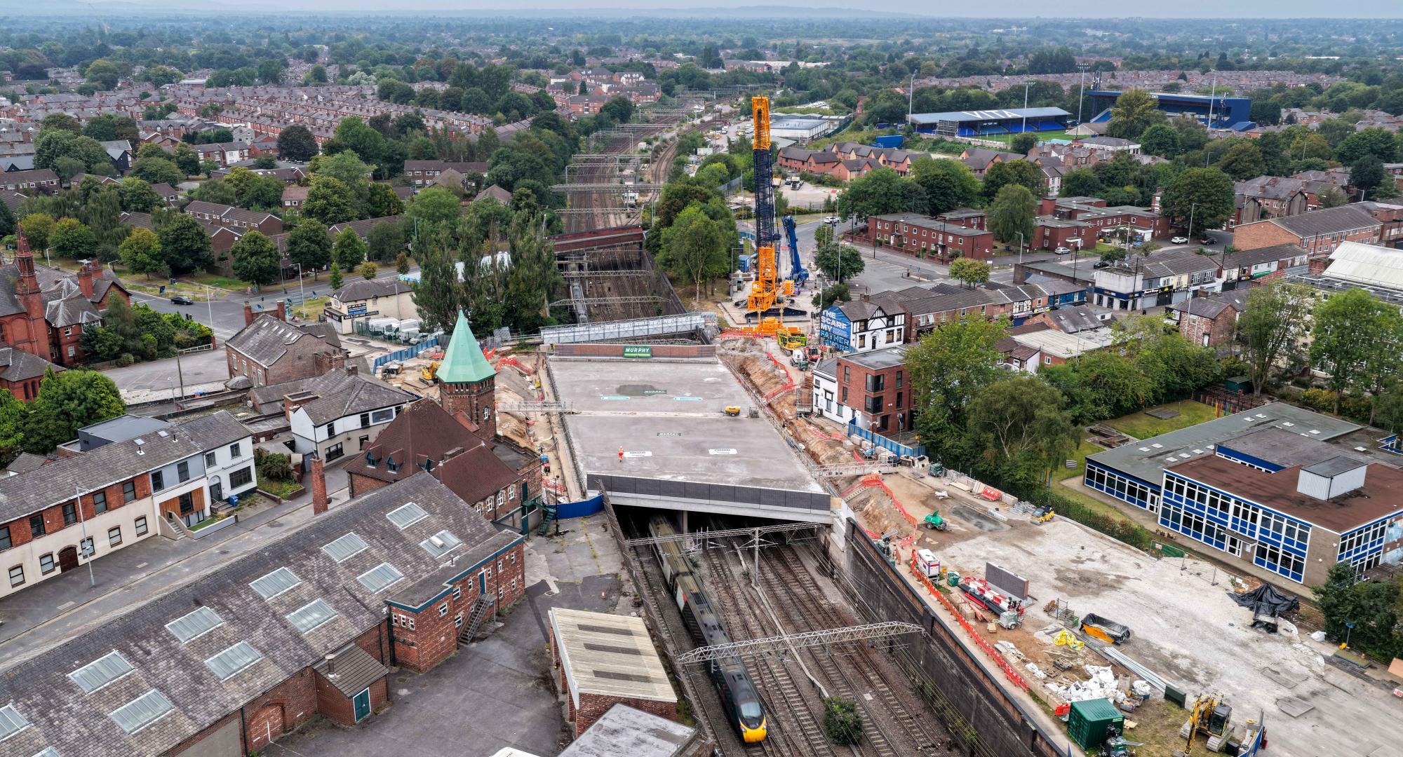 Drone image of first trains running under new Greek Street railway bridge