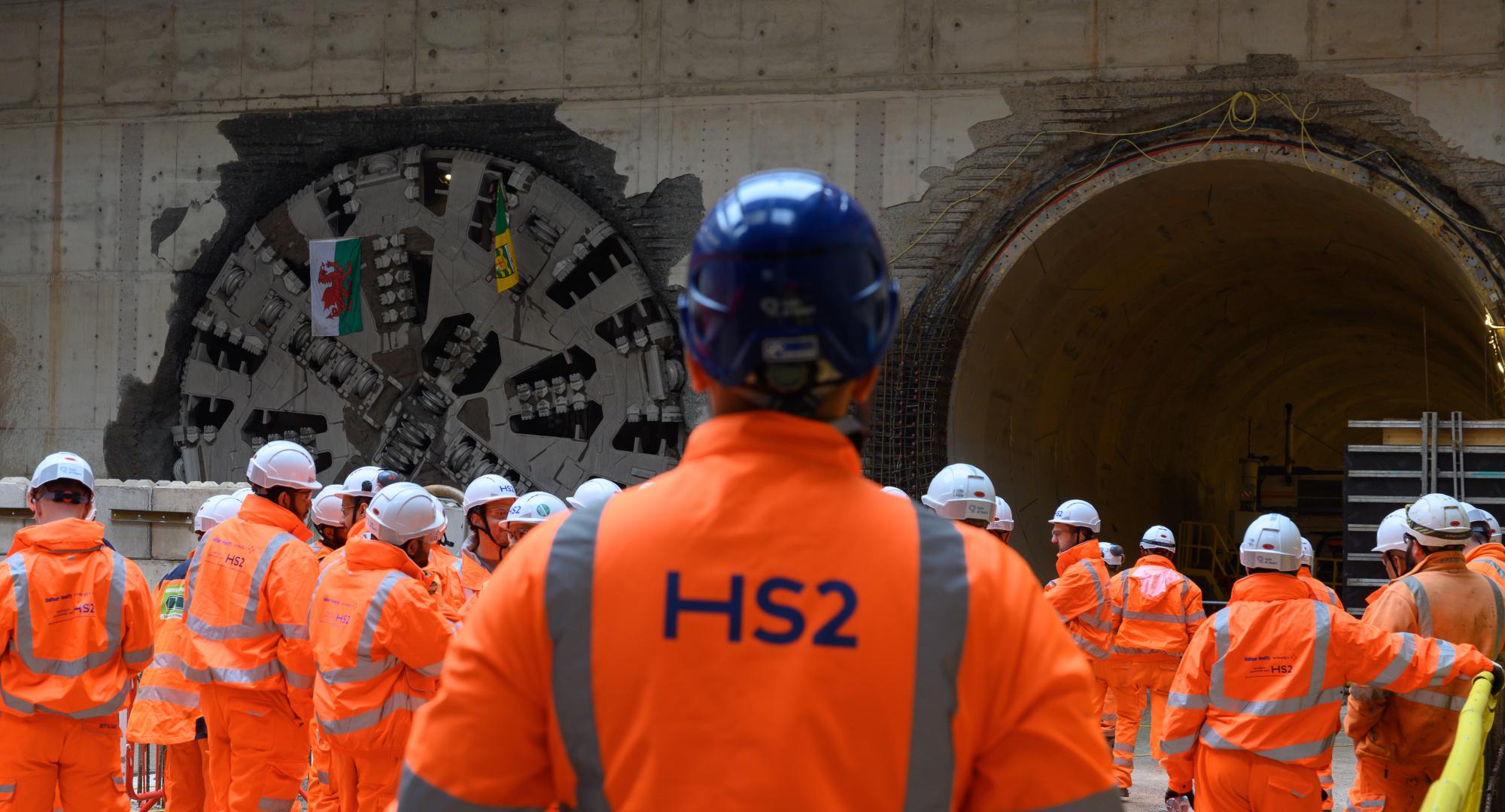 Workers watching the breakthrough