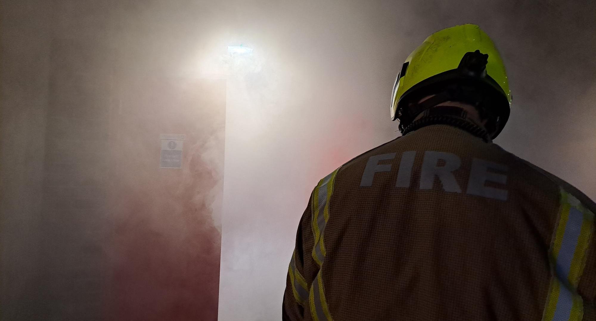 Fireman in smokey room