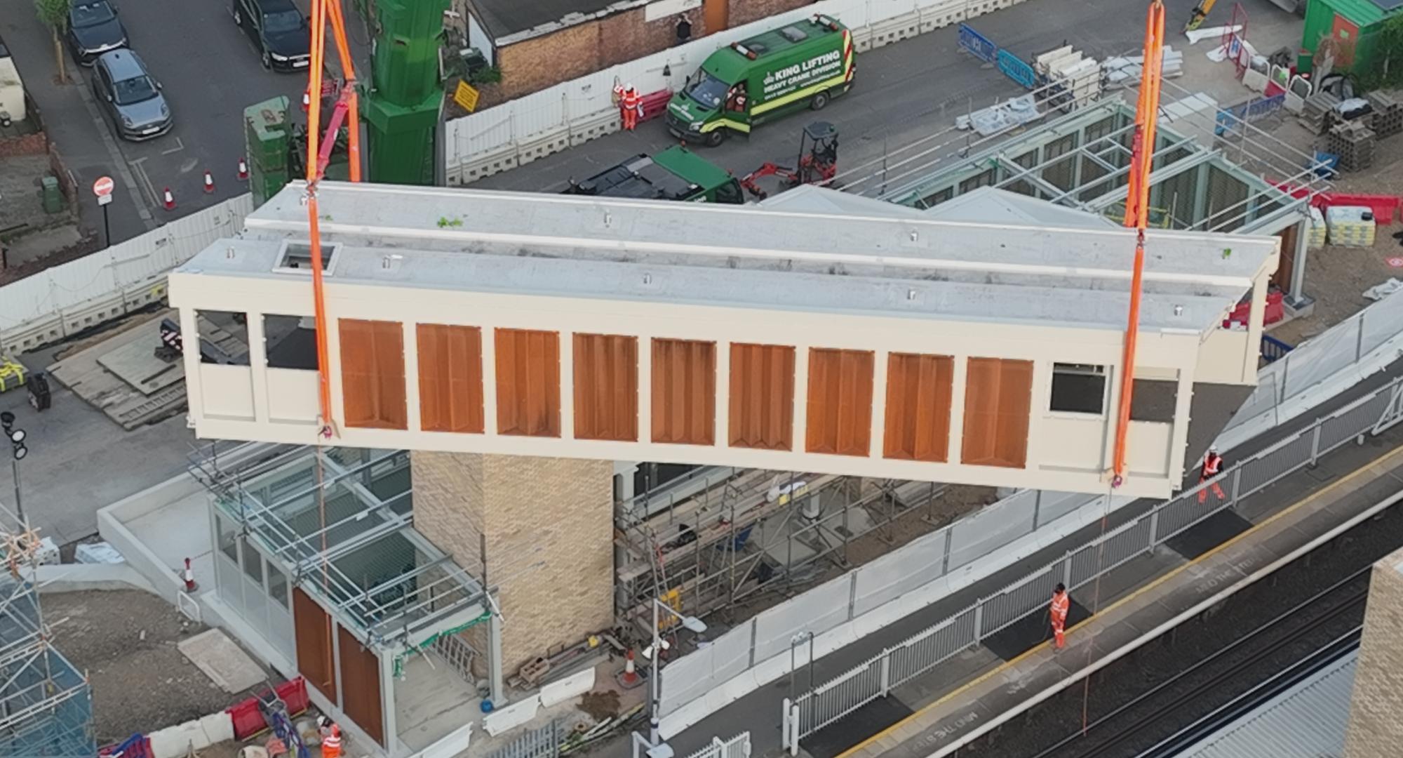 Footbridge section lifted into place at Hither Green
