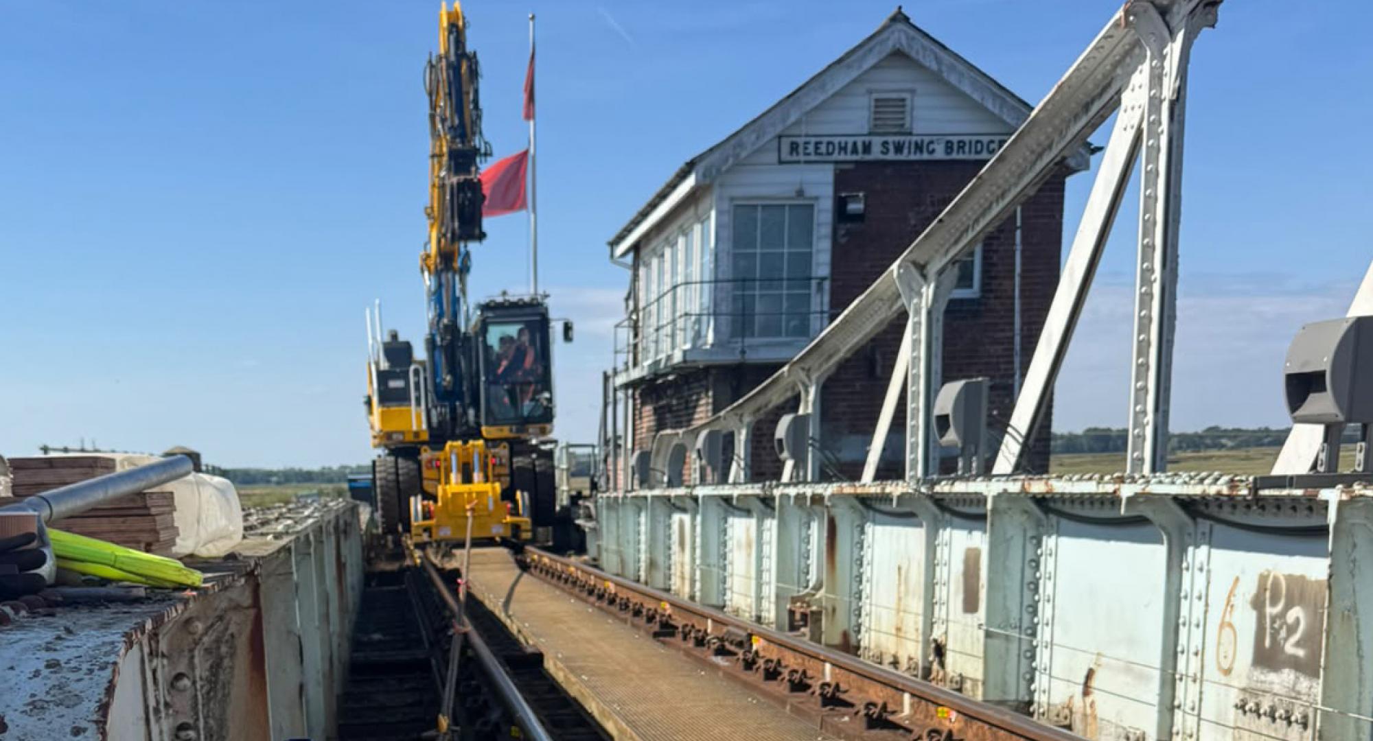 A road rail vehicle working on the bridge