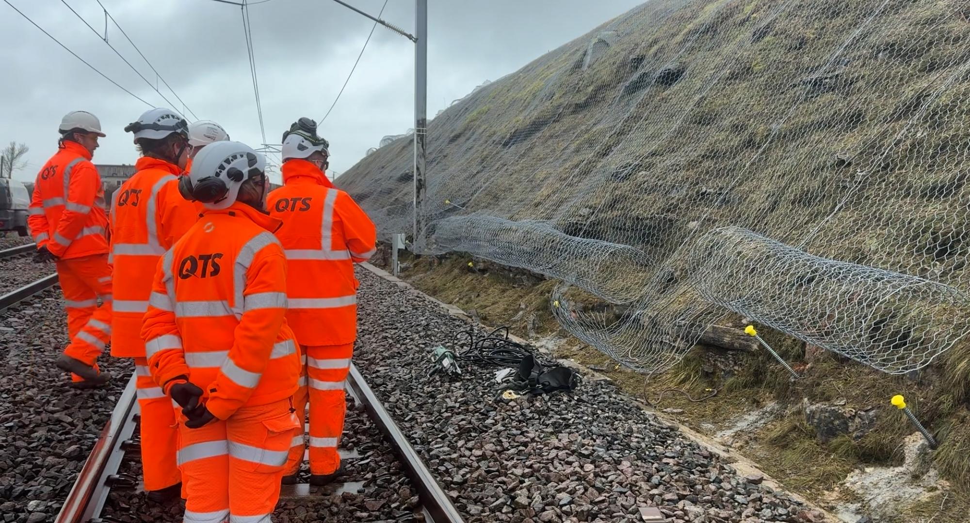 Surveying rock at Shap