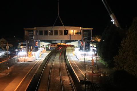 Bridge span is installed at Llanelli station as part of construction of accessible footbridge