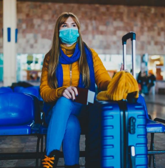 Woman at station waiting for missed or cancelled transport due to a coronavirus