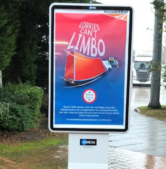 Network Rail bridge strikes poster at motorway service station