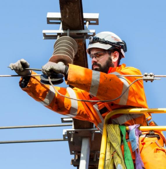 Man doing overhead line equipment work 