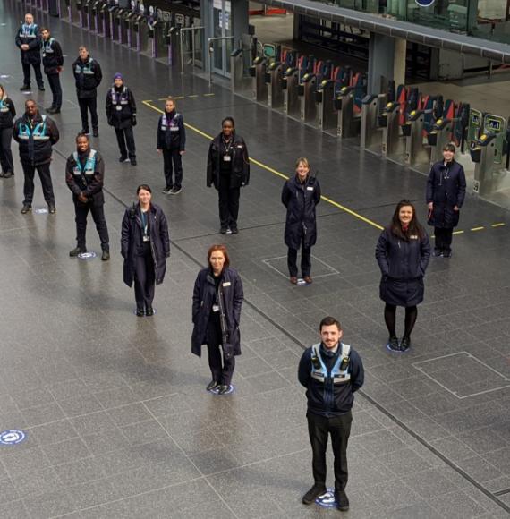 Train crew and station staff on the social distancing guides at Manchester Piccadilly