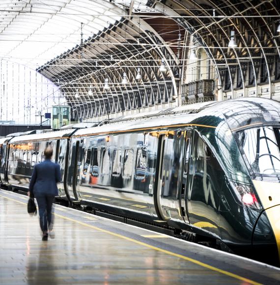 Commuters wander around a train platform