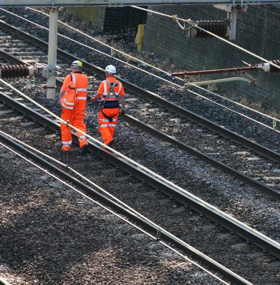 Rail workers on the train line