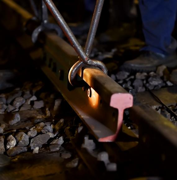 Rail workers laying a section of track