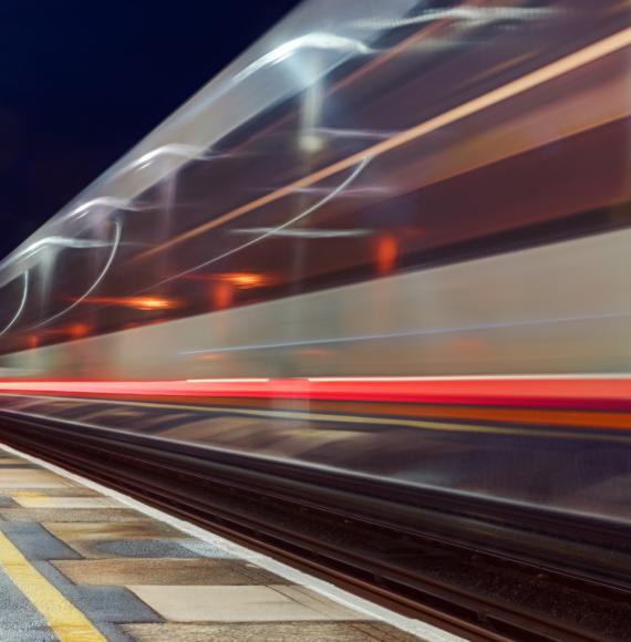 Train in motion at a platform