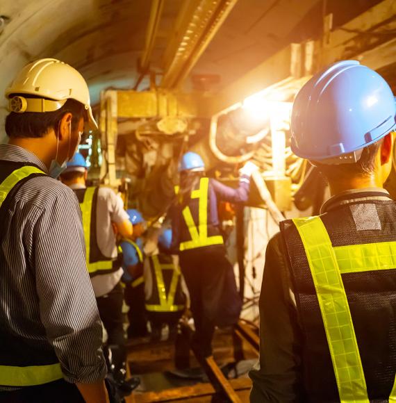 Engineers in a tunnel performing maintenance