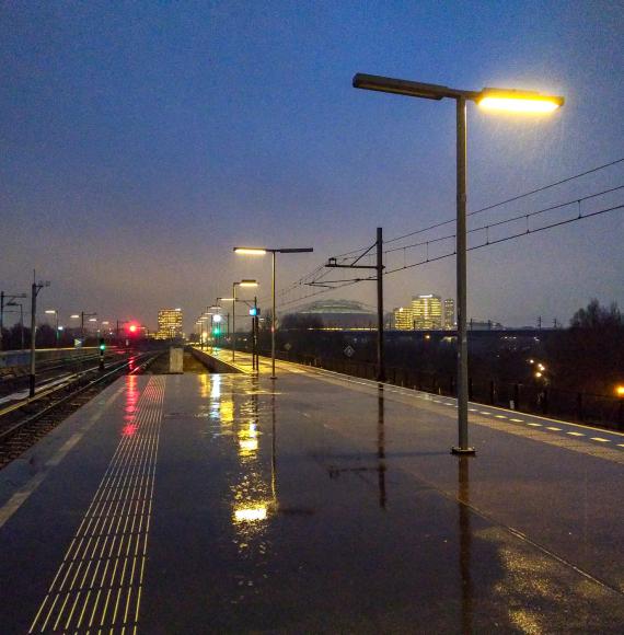 Railway platform during heavy rain