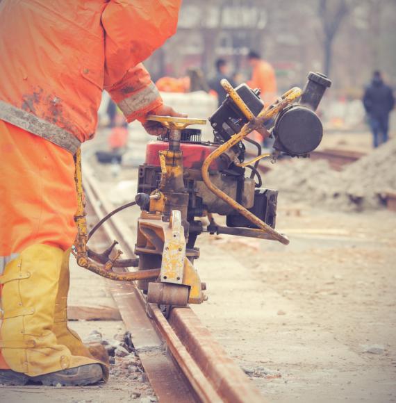 Welder performing work on a section of track