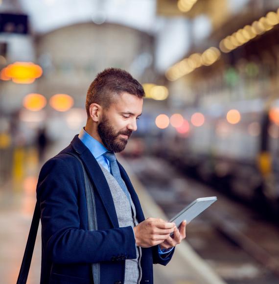 Businessman waiting for a train in London