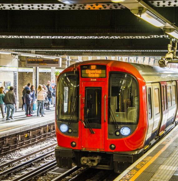 London Underground train arriving at a station