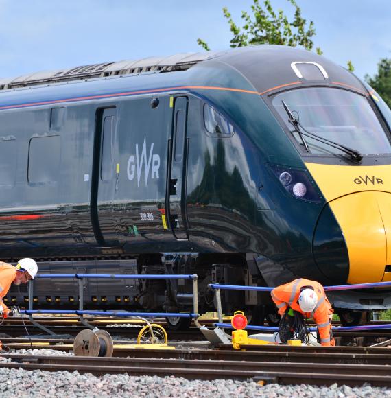 Engineers working in front of the train