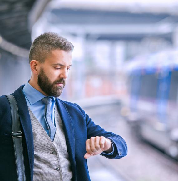 Businessman at a train platform