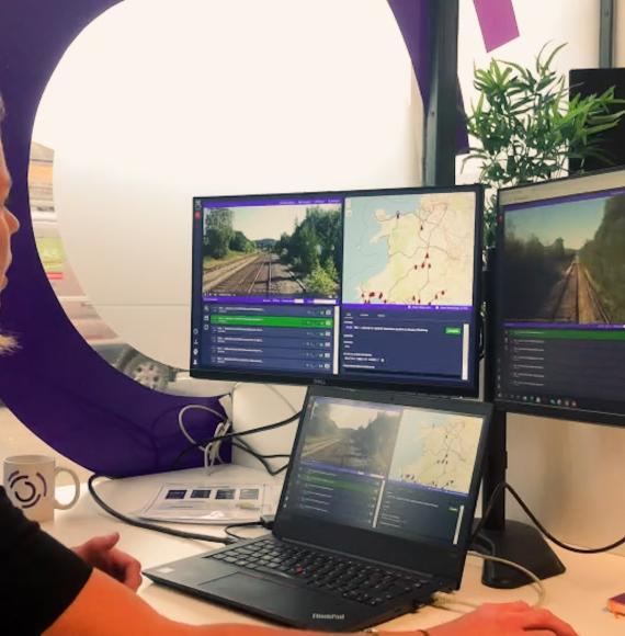 Woman looking at computer screens