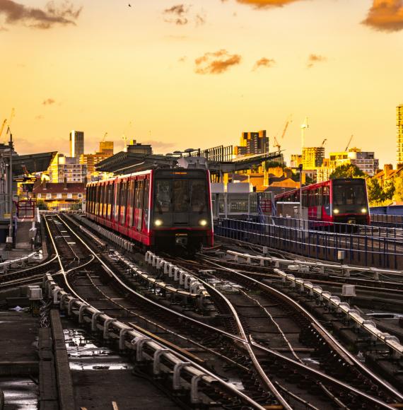 Docklands Light Railway (DLR) trains at sunset