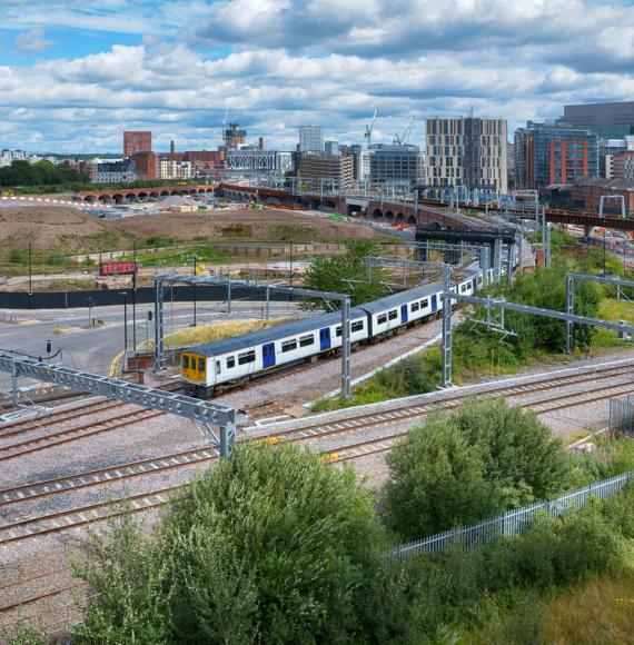 Train travels through Manchester