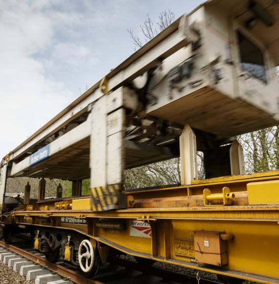 The NTC (new track construction) machine in action on the Dartmoor Line, via Network Rail 