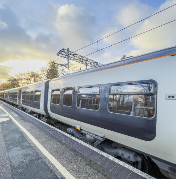  An electric powered train passes through the British Rail station, via Istock 