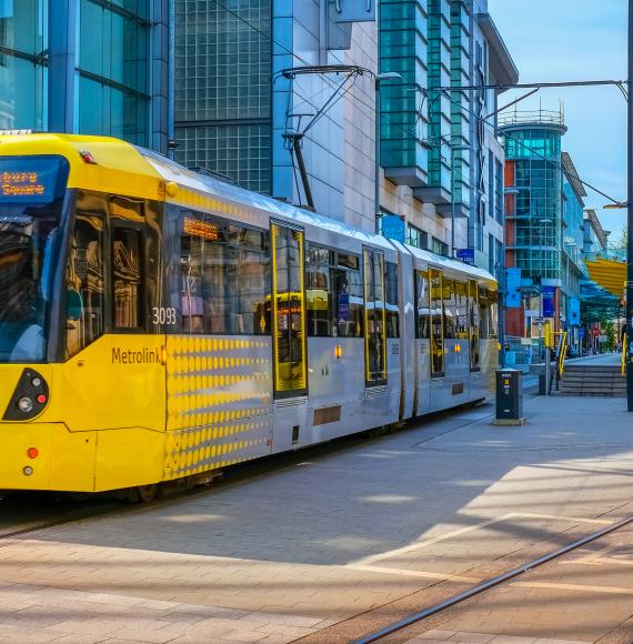 Light rail Metrolink tram in the city center of Manchester, UK. Via Istock 