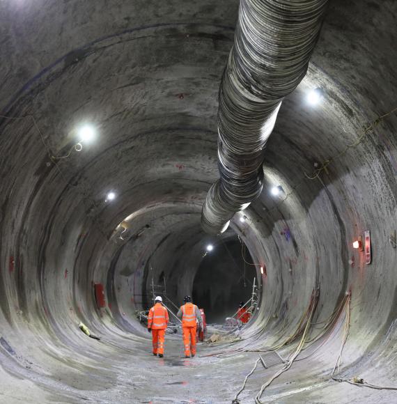 Engineers walking through the traction substation tunnel beneath HS2's Euston Station, via HS2 