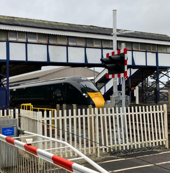 GWR train at Truro station with level crossing that will be upgraded