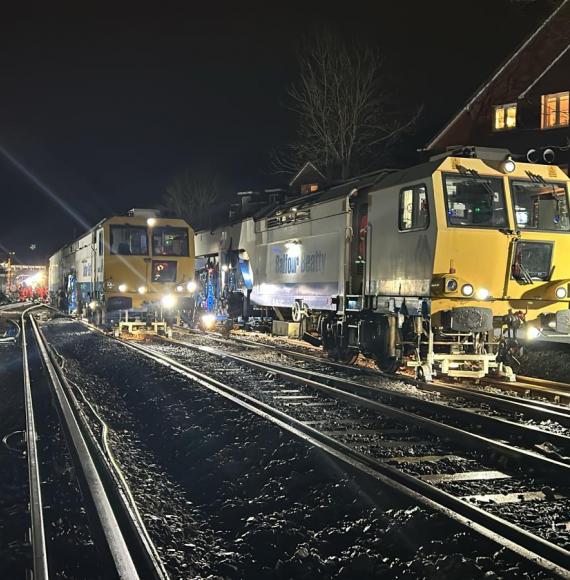 A tamping machine working at night in Wokingham