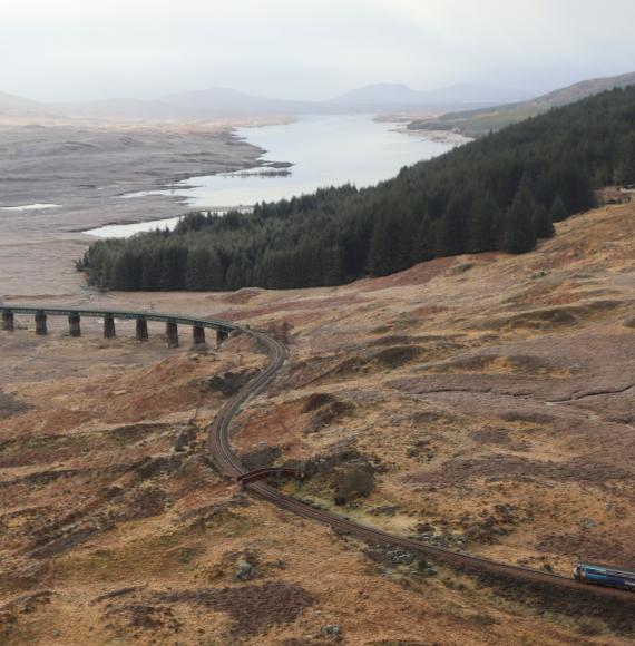 ScotRail train approaches Rannoch Viaduct