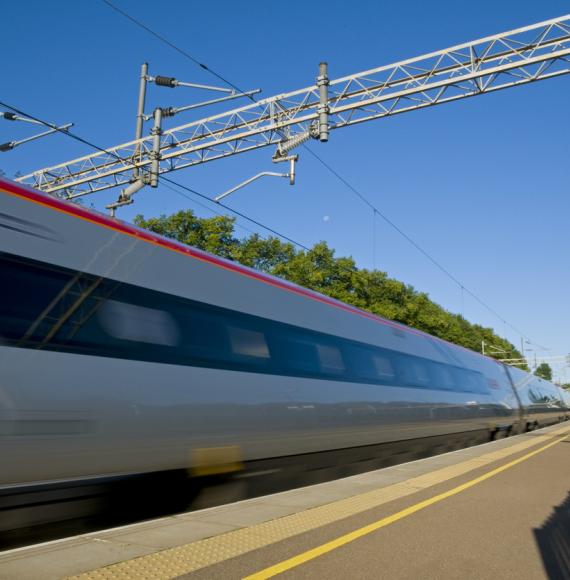 High-speed train passing through station