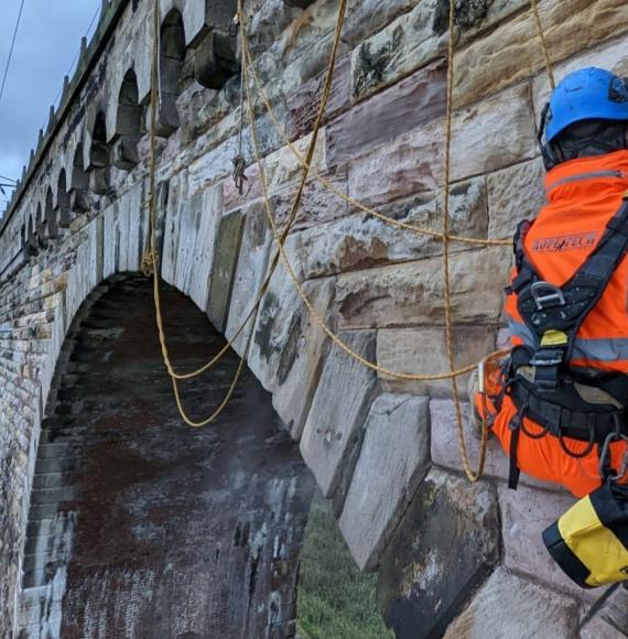 Man working on rail bridge 