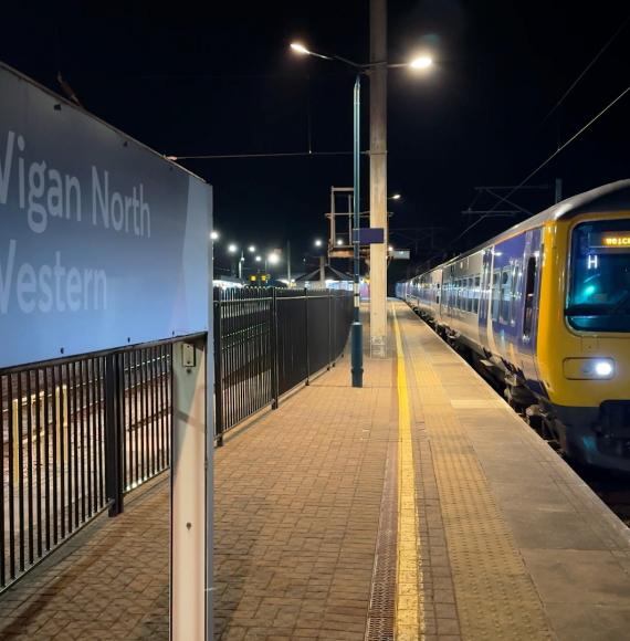 First shot of an electric train leaving Wigan North Western and Bolton under electric power