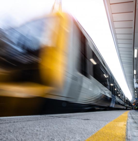 Passenger train leaving a railway station
