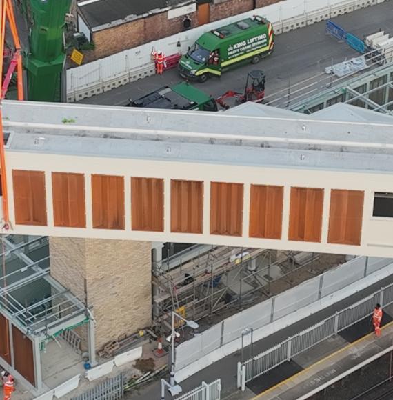 Footbridge section lifted into place at Hither Green