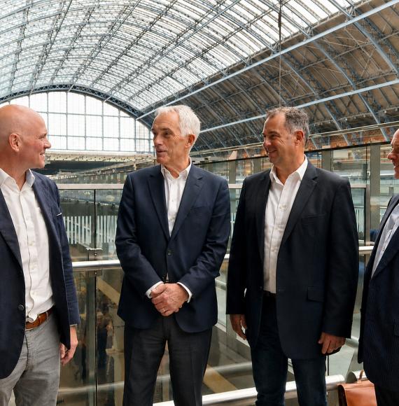four men on gantry