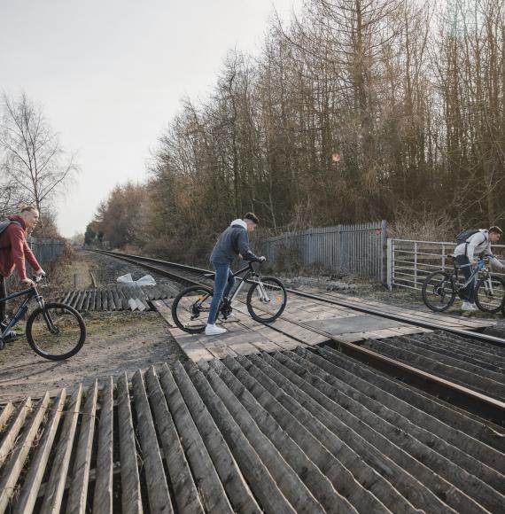 Teenagers on a level crossing
