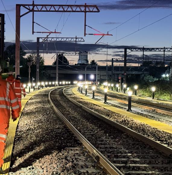 Workers inspecting new Oldfield Road turnback siding