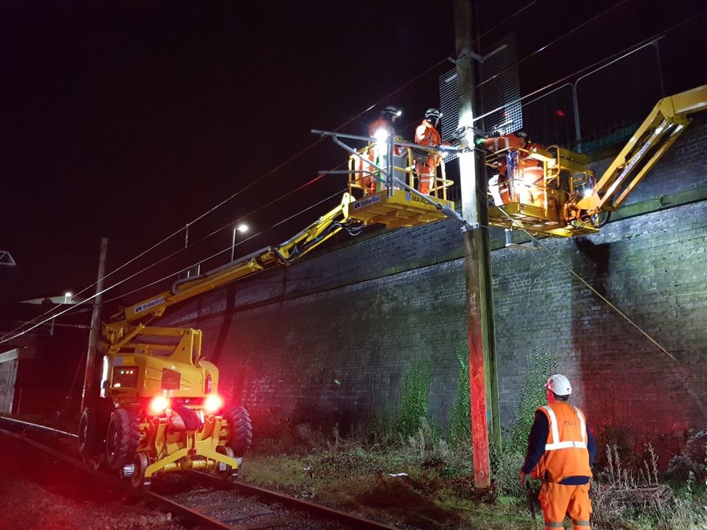 Overhead power lines between Preston and Blackpool being connected to the WCML