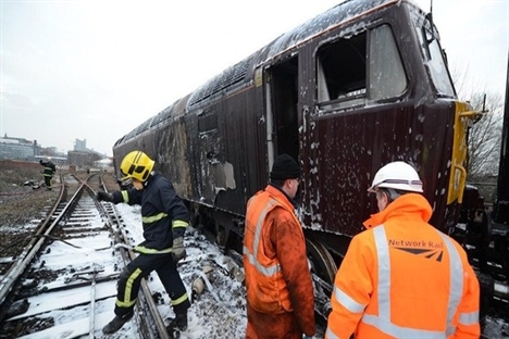 Derailed train catches fire in Salford